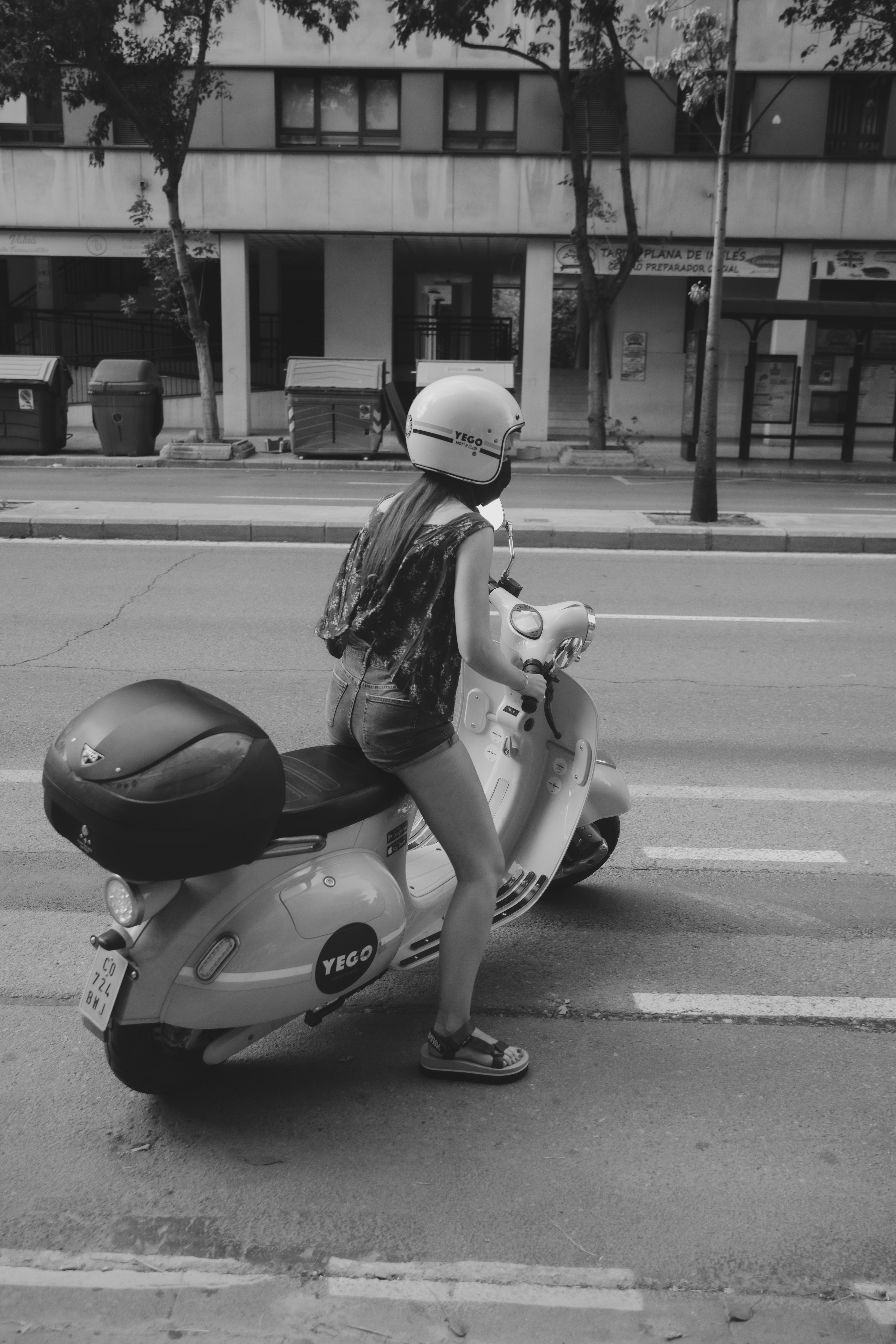 grayscale photo of woman riding motorcycle